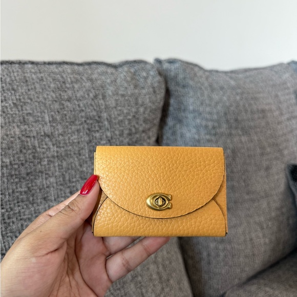 Coach Handbags - Coach Yellow faux leather Wallet